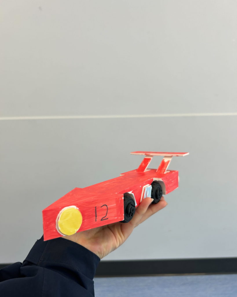 A kid working on a projectA 3D printing car from our 3Dprograms for kids (2)