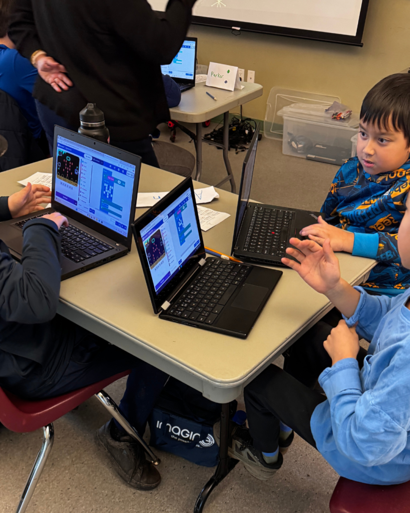 Kids working on a project during one of our AI program for kids.