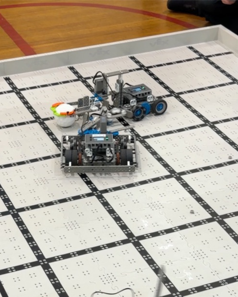 Kids playing robot soccer